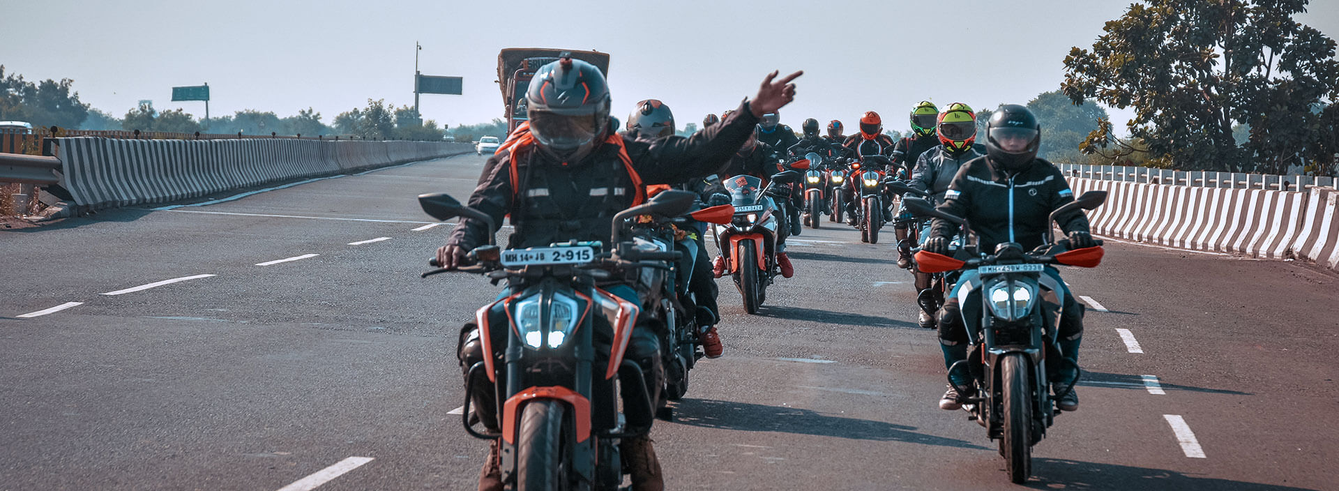 KTM bike riders going on long trip on highway 